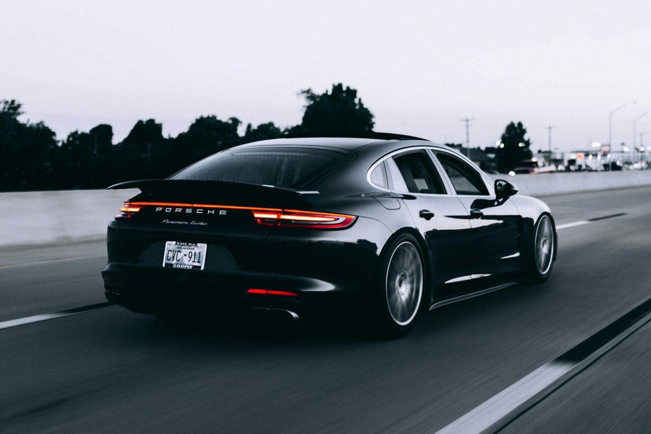 Black Porsche on a road