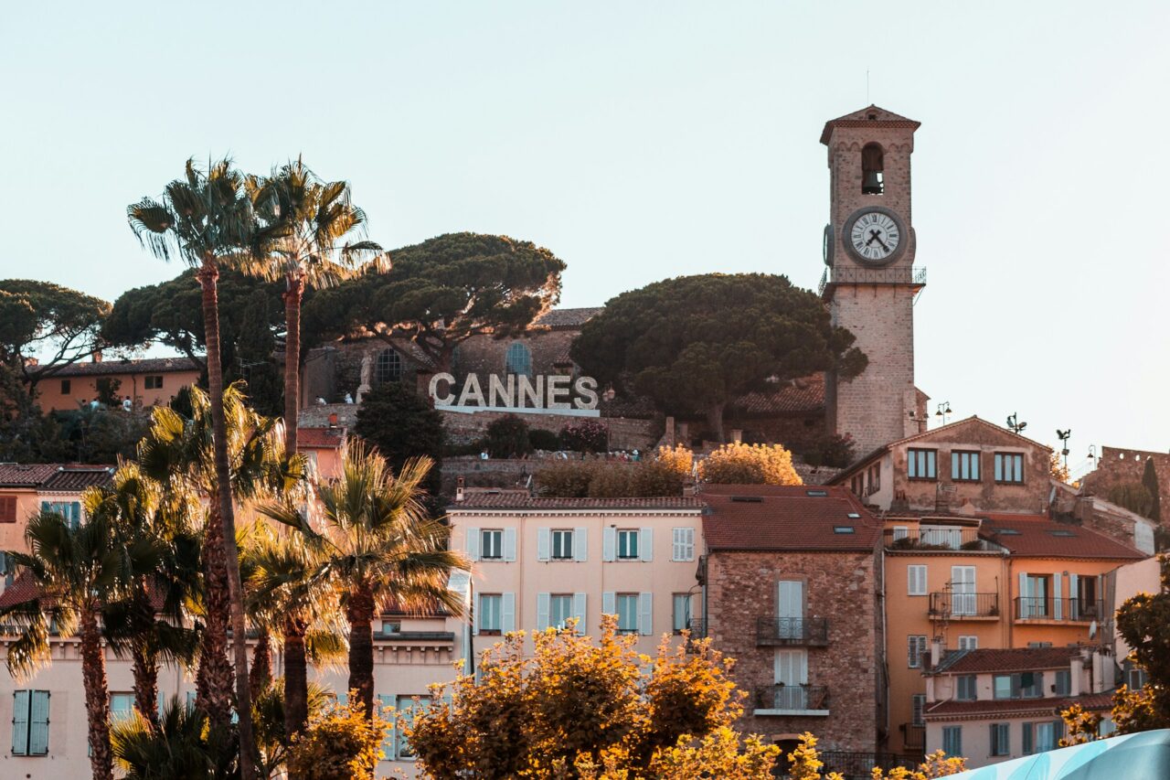 Clock tower and "Cannes" sign in Cannes, France