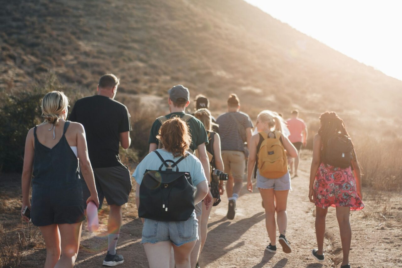 Group of young people walking on a trail