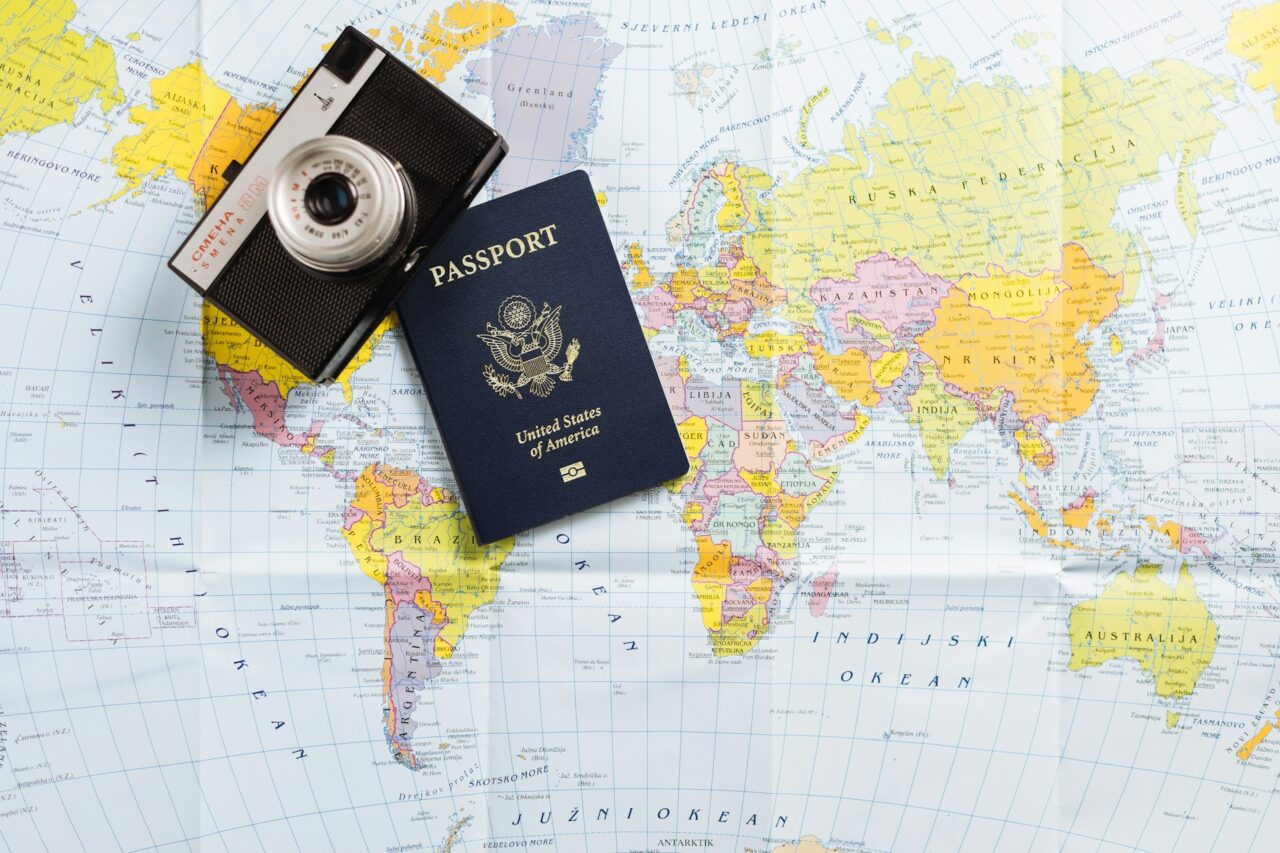 Passport and camera on a map
