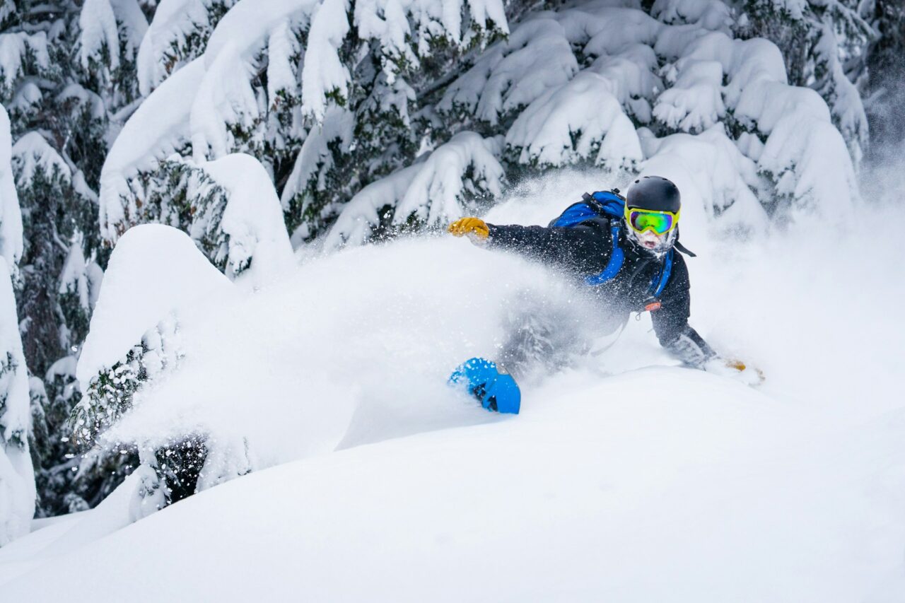 Person snowboarding down a snowy mountain