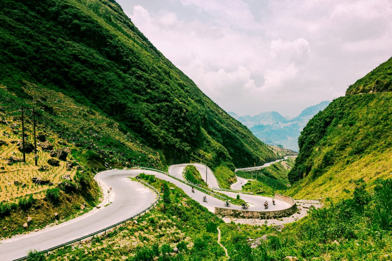 Winding road through green mountains in Ha Giang, Vietnam