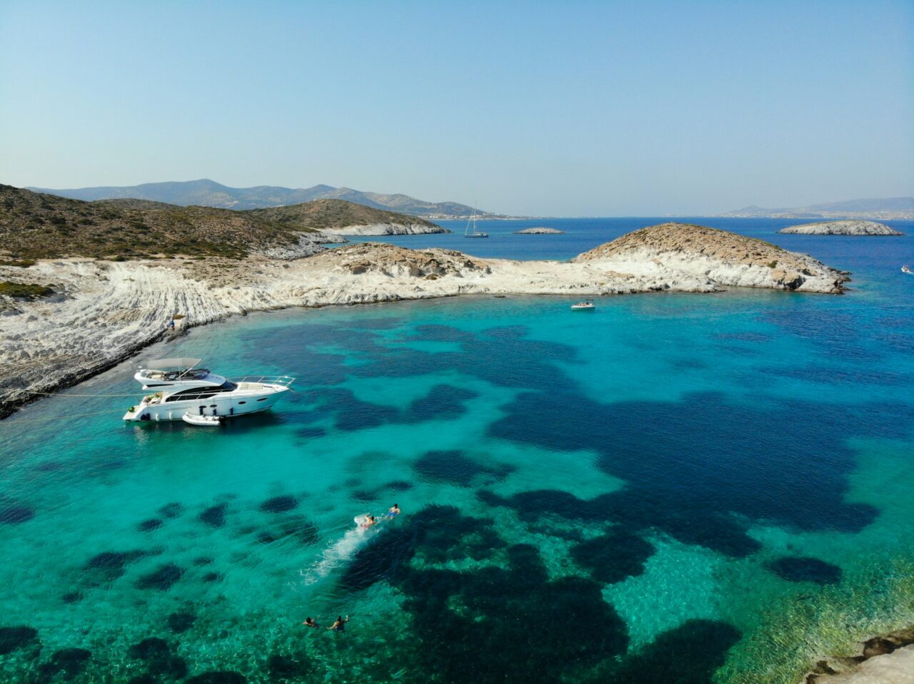 Boat anchored on the water in the Cyclades, Greece