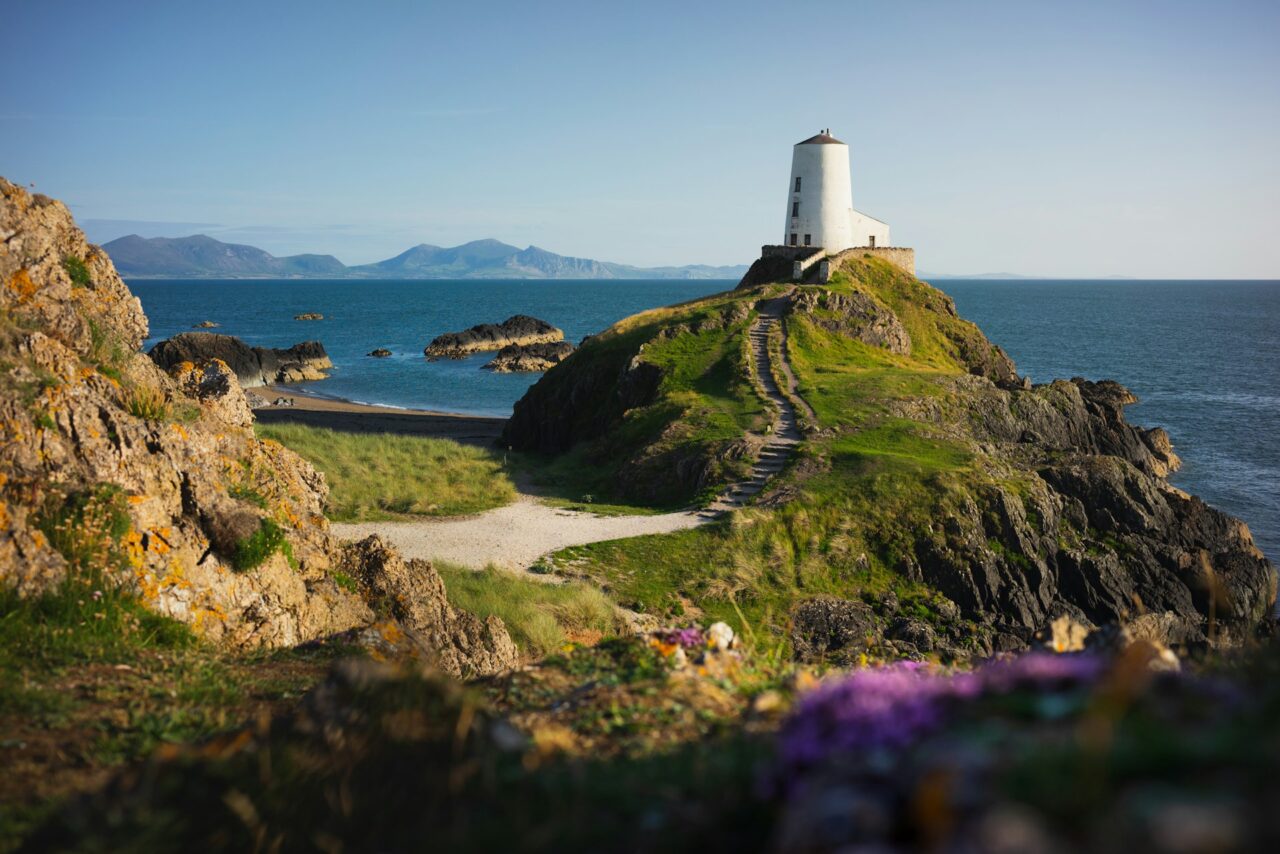 White lighthouse on a hill in Wales