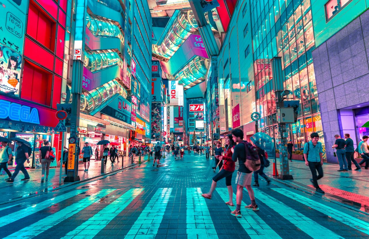 Busy Shibuya crossing at night in Tokyo