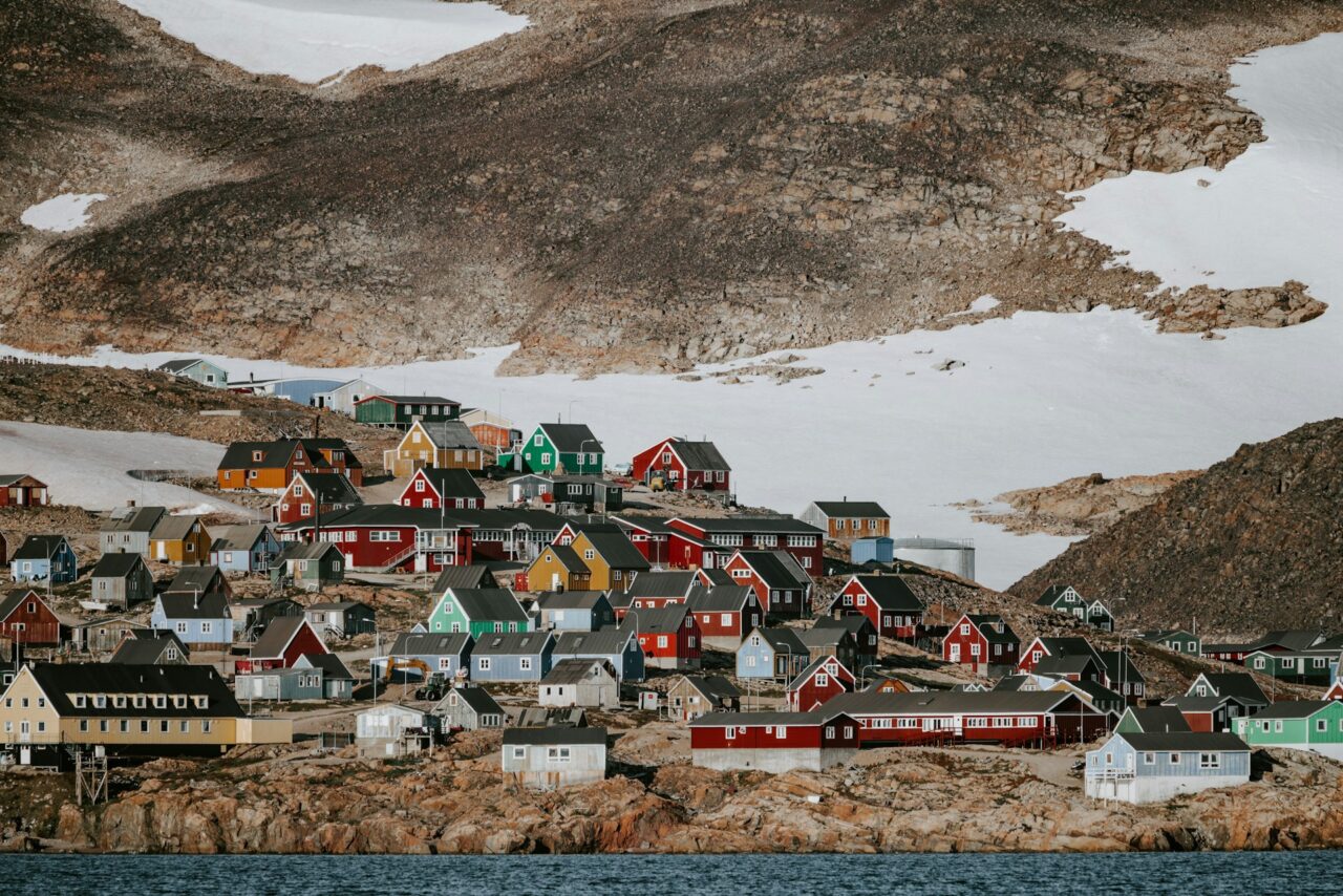 Colorful houses perched on a cliff in Greenland