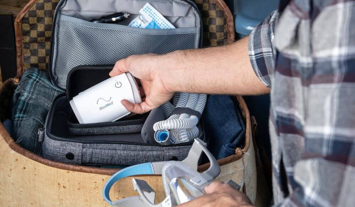 Packing portable CPAP machine with mask and tubing