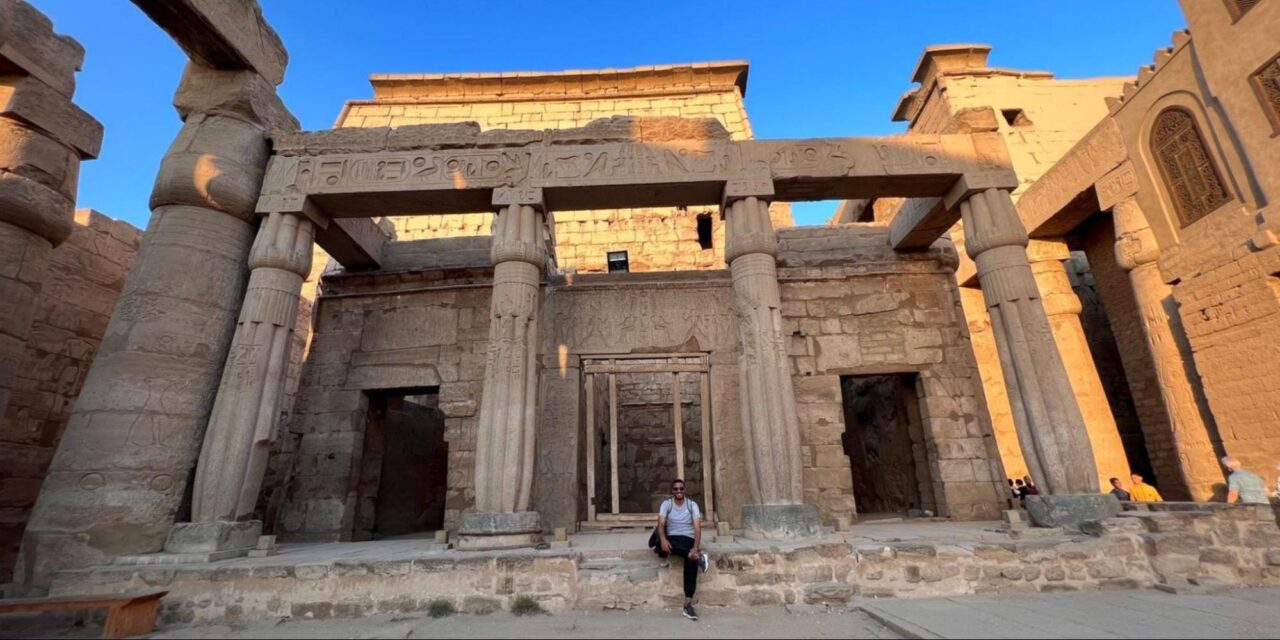 Person standing outside a temple in Egypt