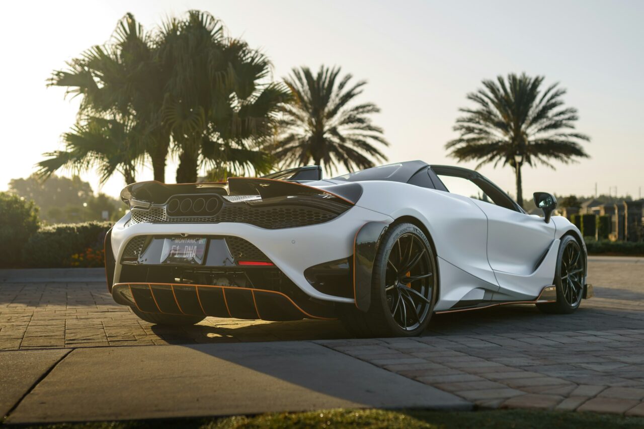 White Mclaren with palm trees