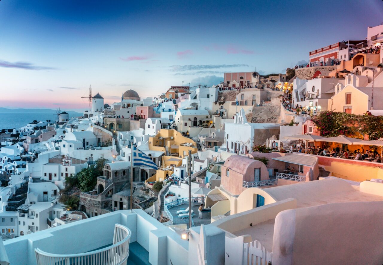 Sunset over the white buildings in Santorini