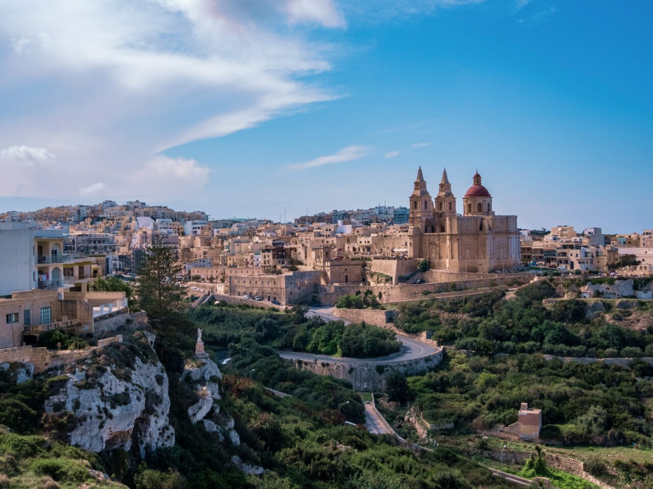 View of a town with church perched on a hill in Malta