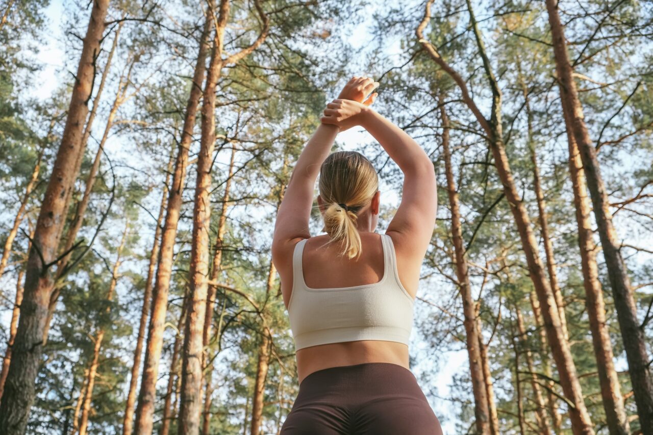 Woman stretching in the forest
