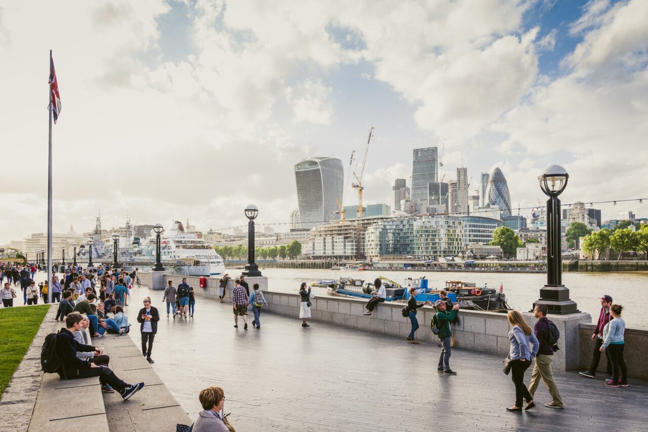 People strolling on the bank of the Thames