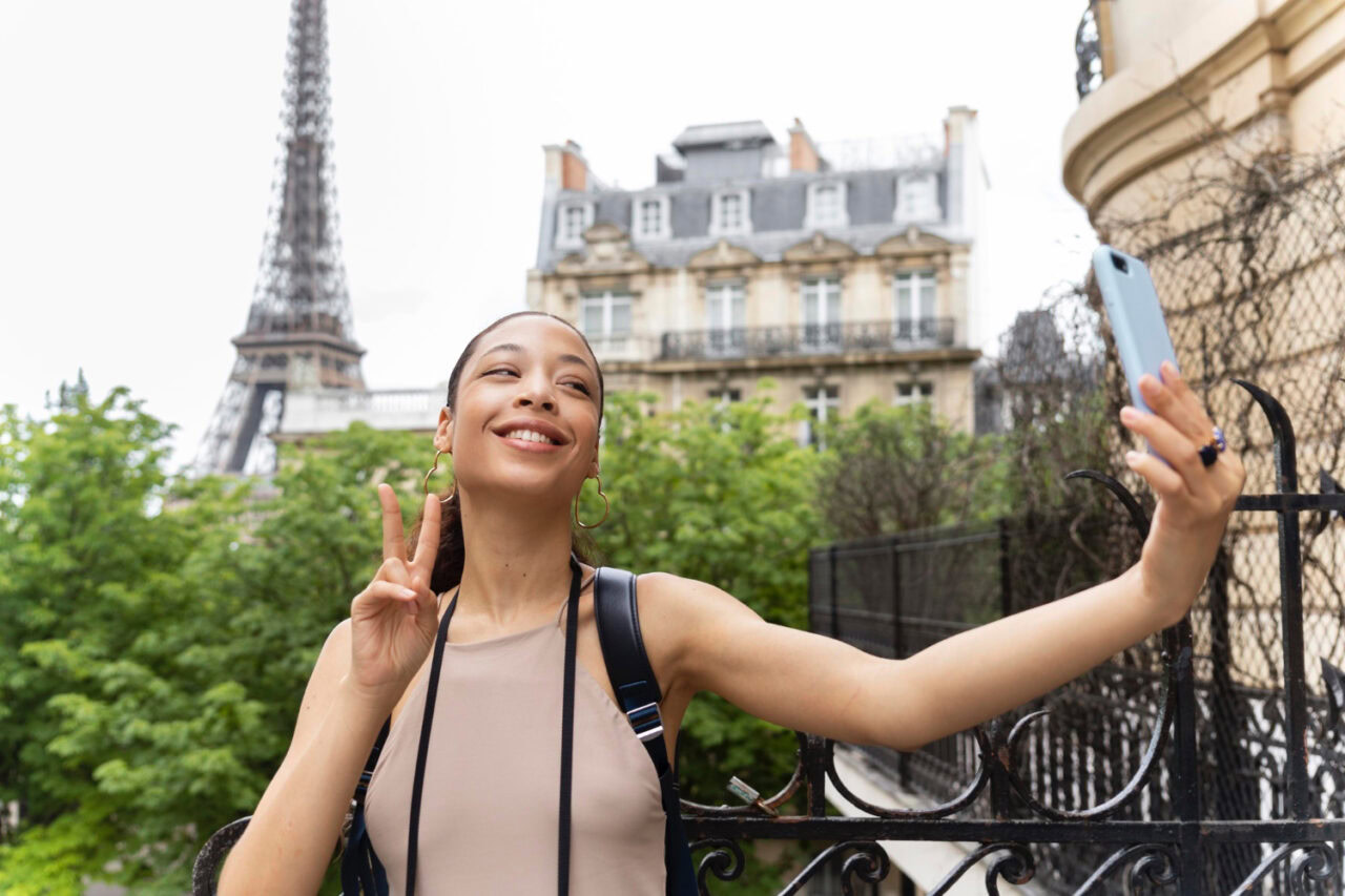 Woman taking a selfie in Paris