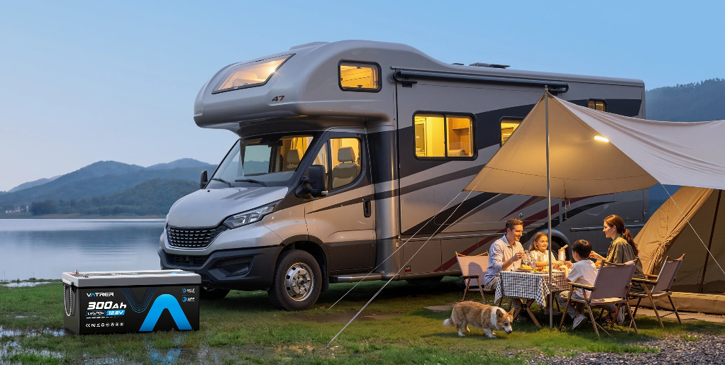 Family eating dinner next to a parked RV
