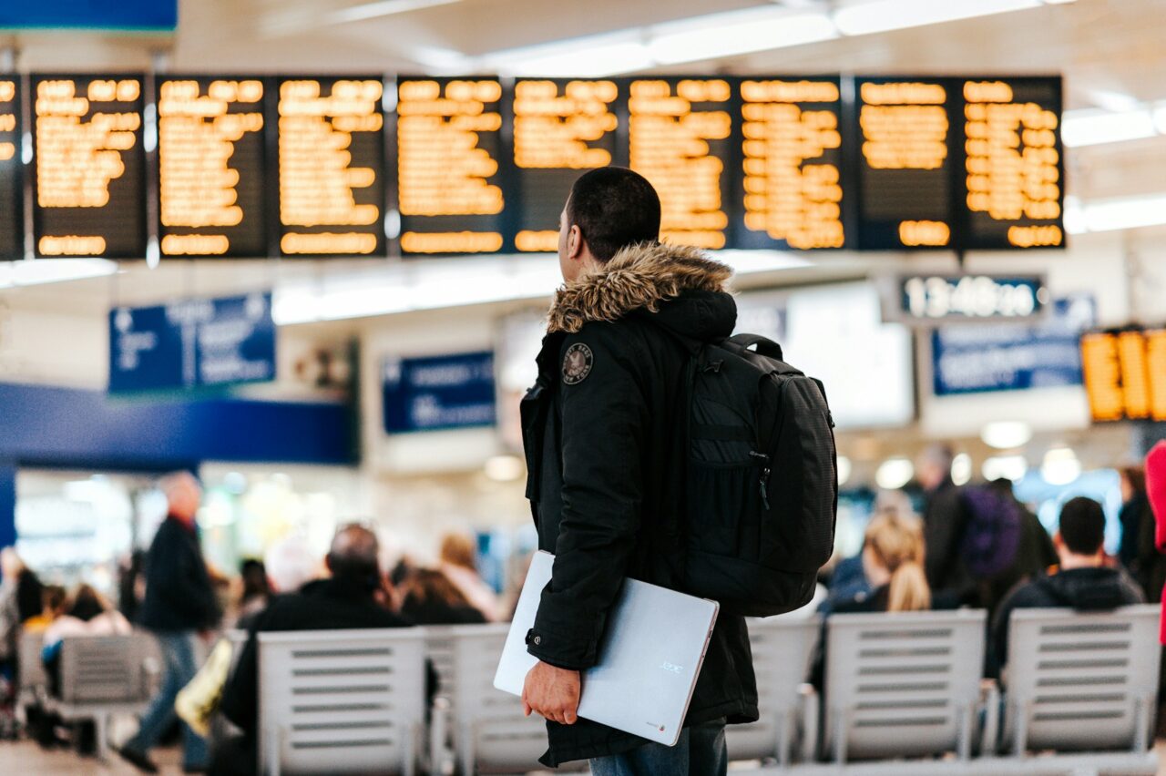 Man looking at a departure board