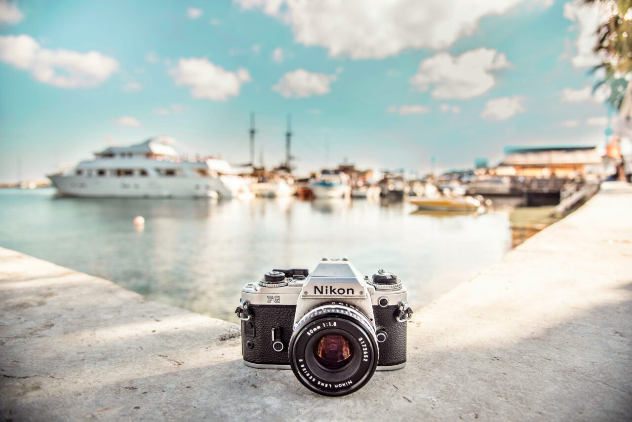 Nikon camera on a wall next to a marina in Greece