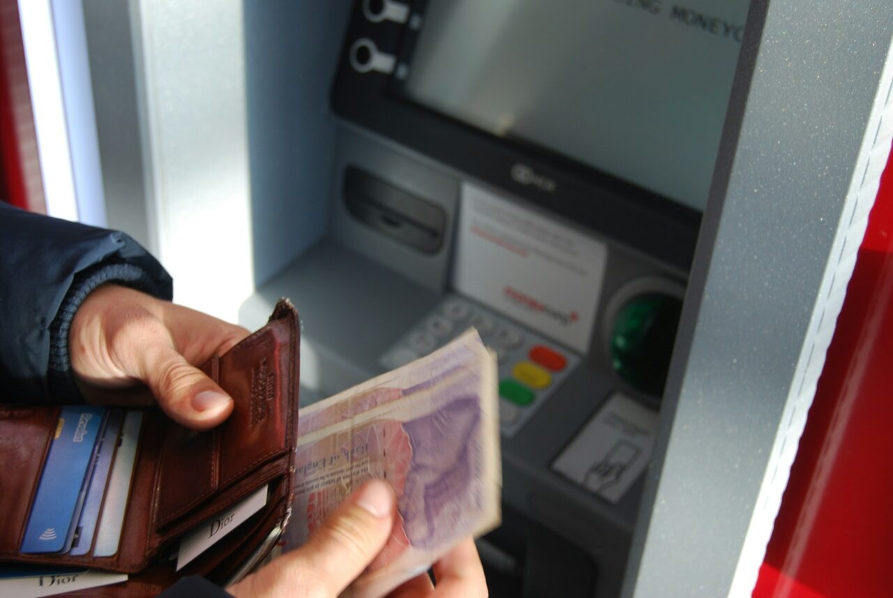 Person withdrawing money at an ATM