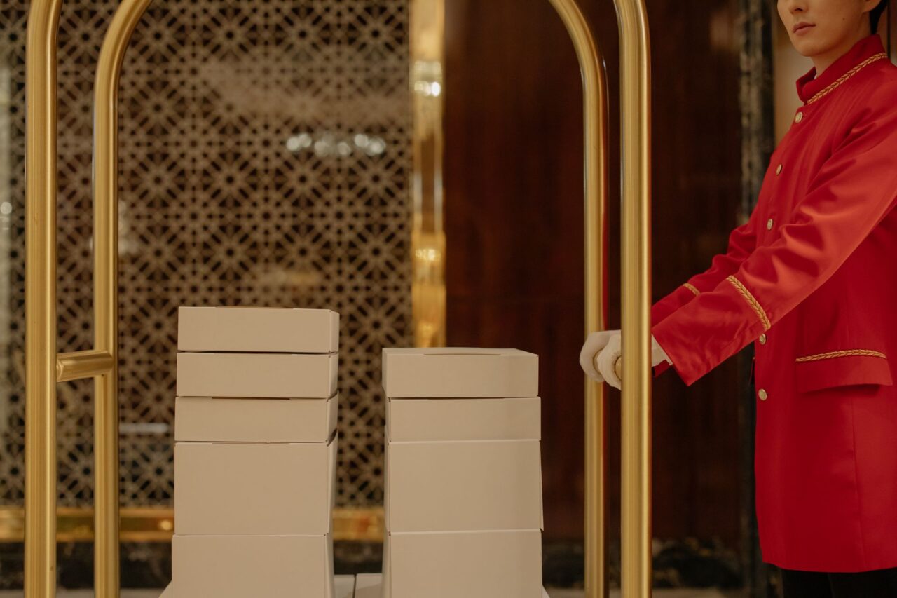 Man pushing luggage cart at luxury hotel