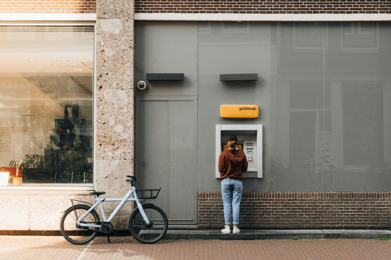 Person standing at an atm in Amsterdam