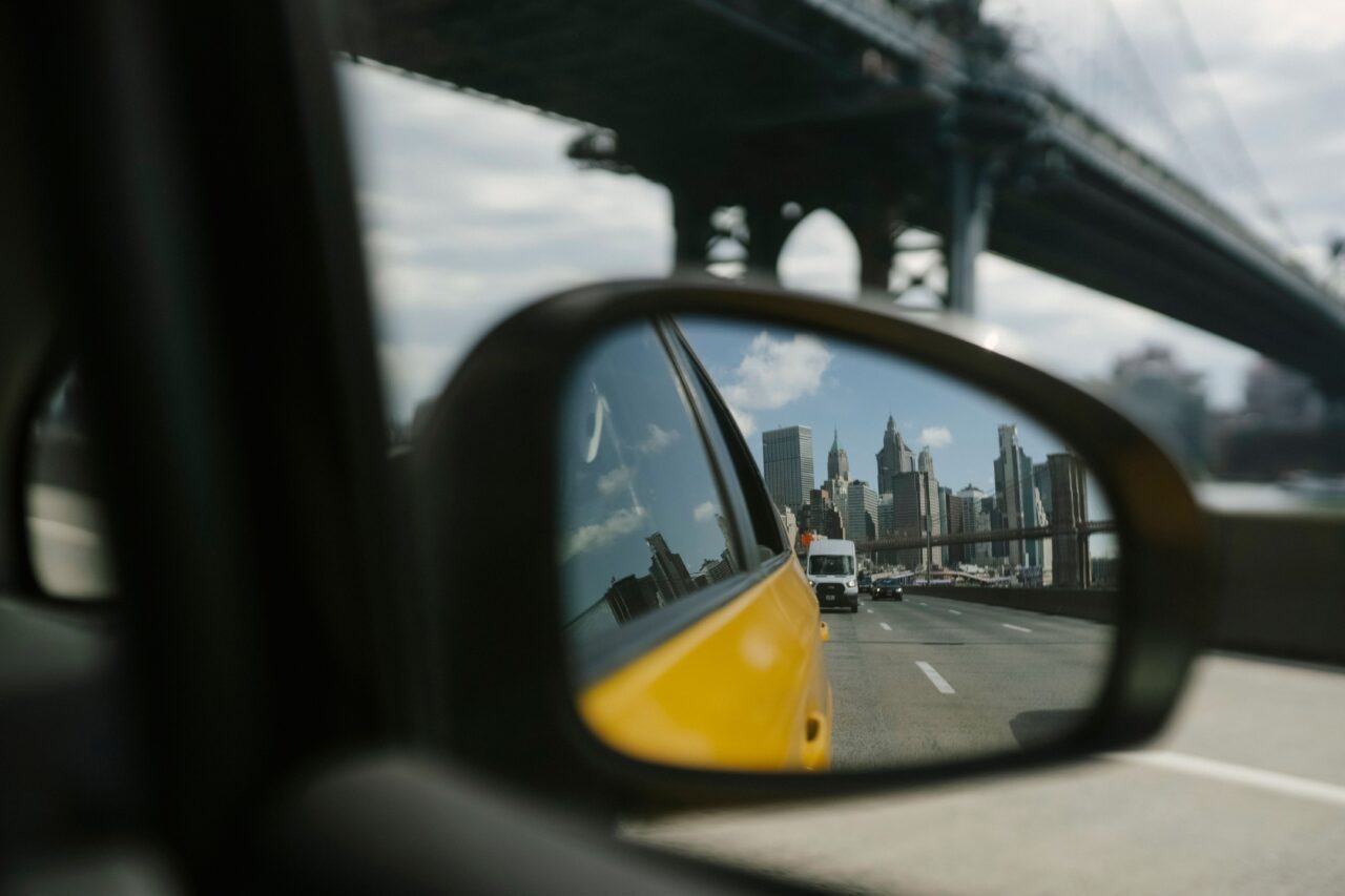 Close up of a car wing mirror while driving