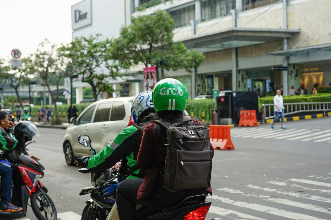 Grab bike driver with passenger in Indonesia