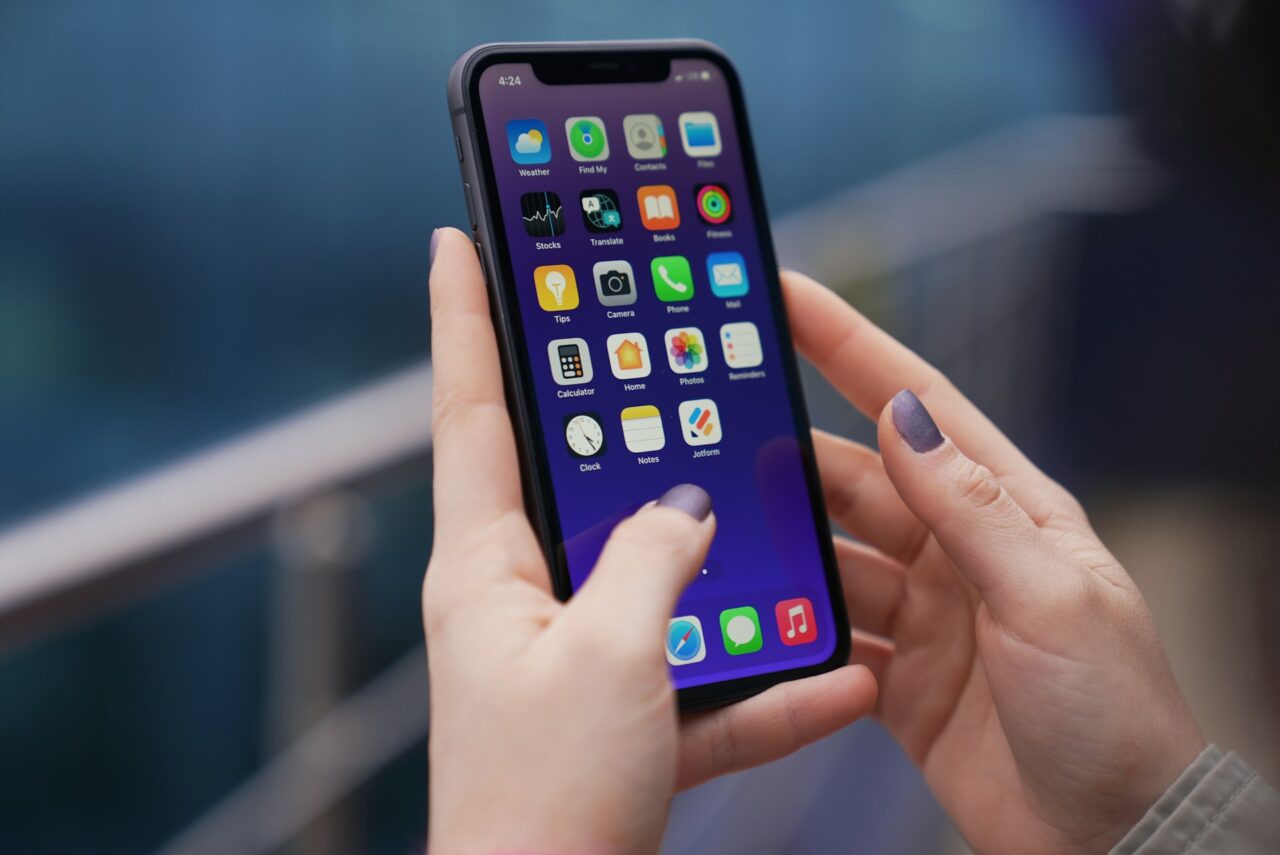 Woman's hands holding an iphone