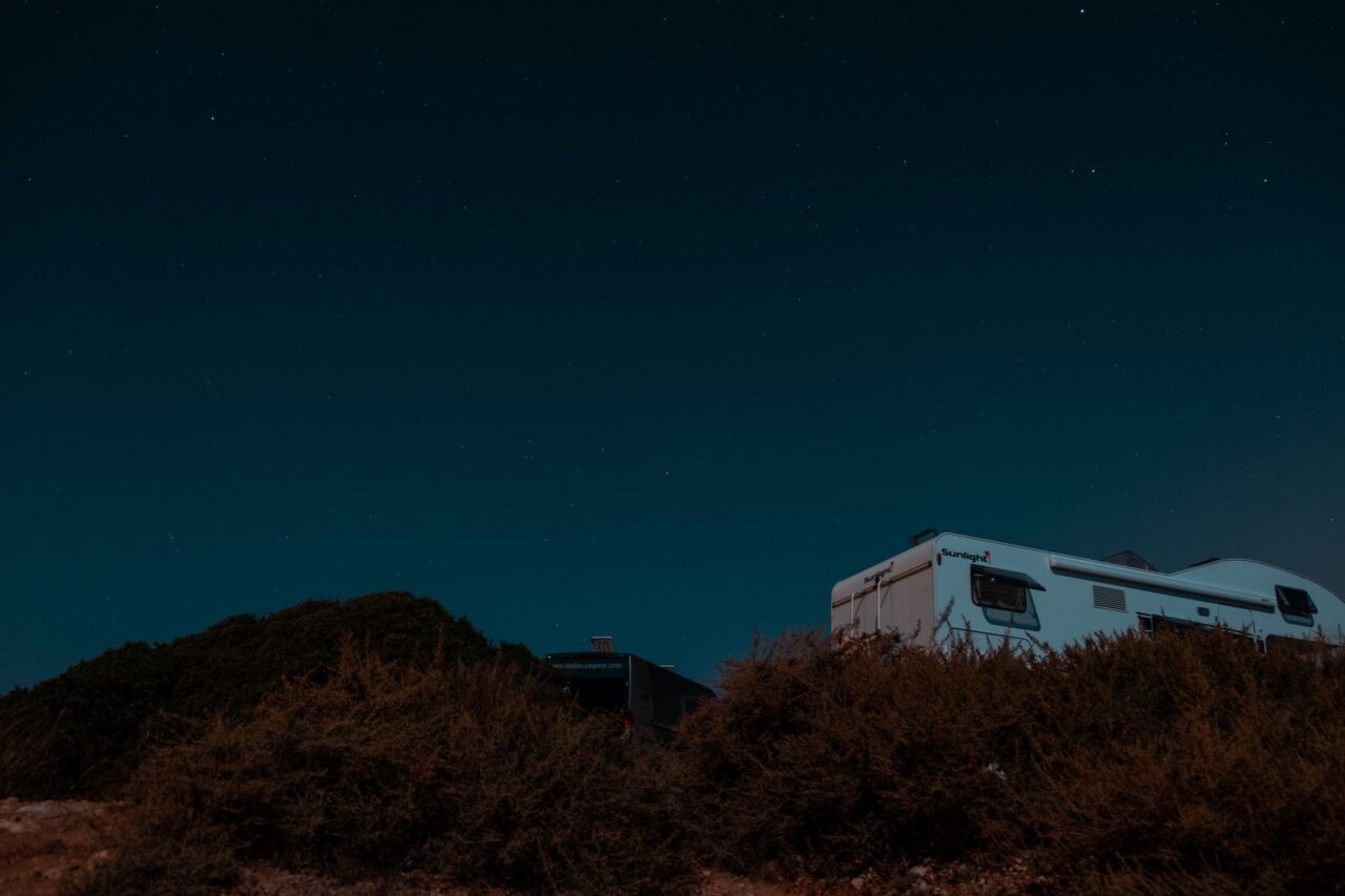 Campervan under night sky