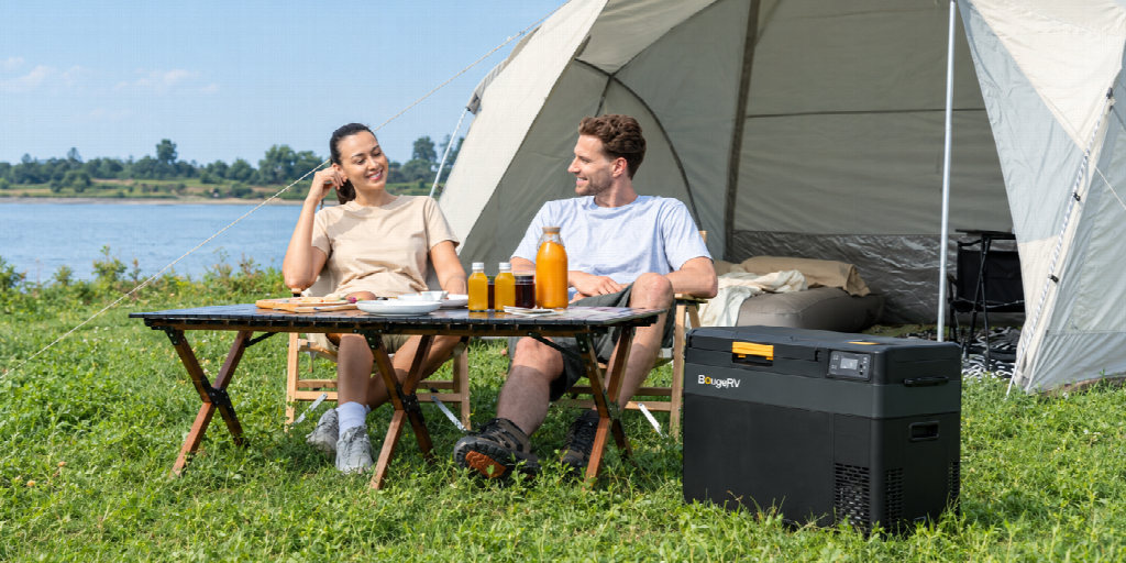 Couple camping with 12V portable cooler
