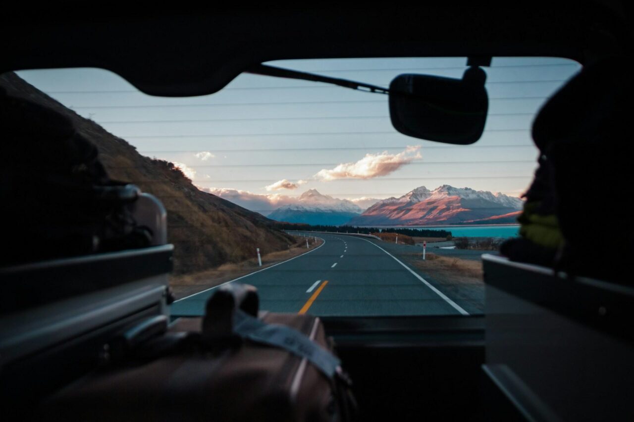 Open road viewed through a car window