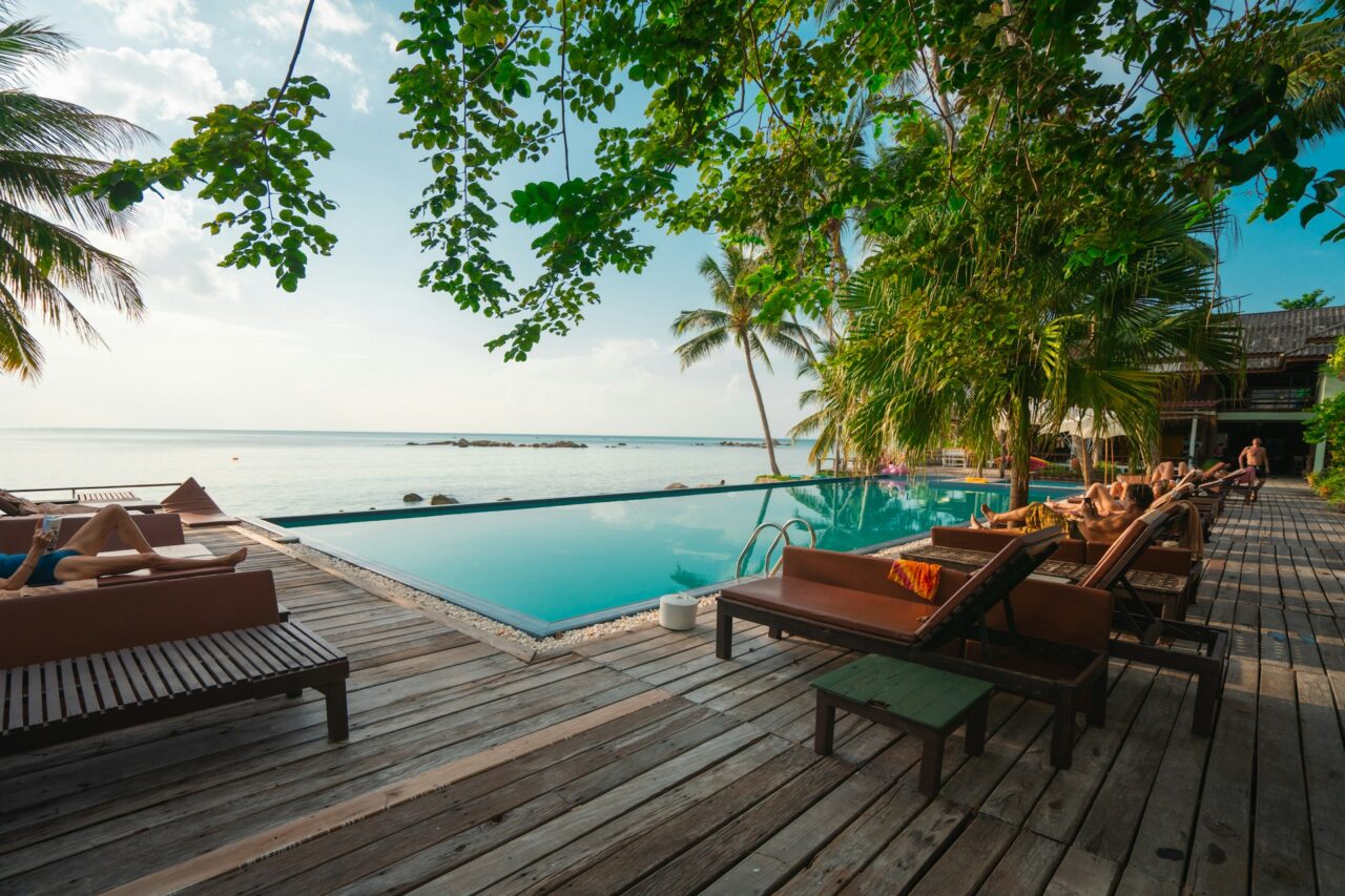 People relaxing around a hotel pool