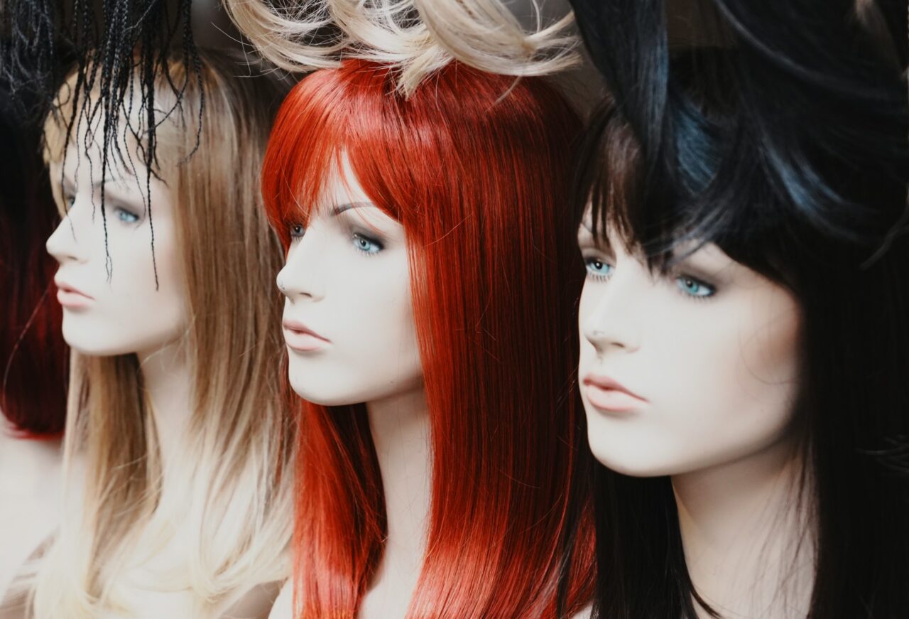 Three mannequins with wigs