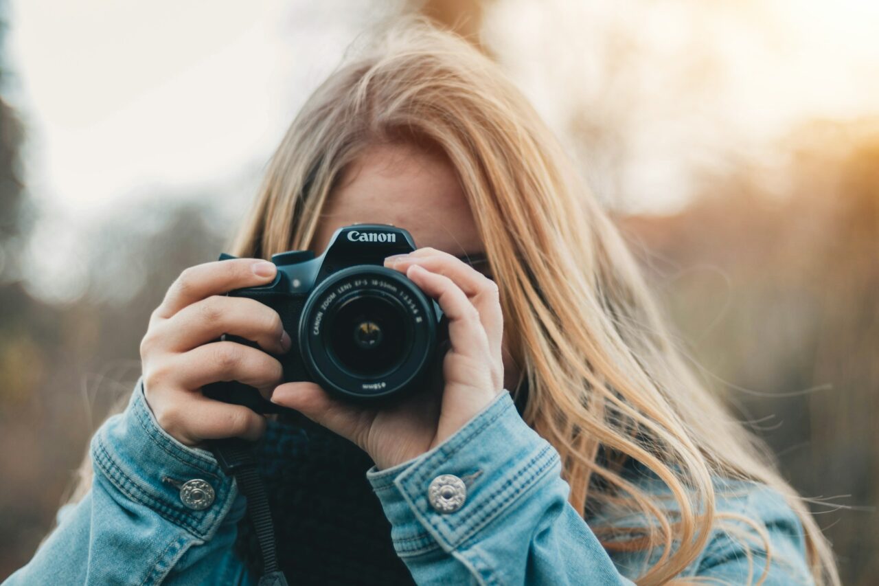 Woman holding a canon camera